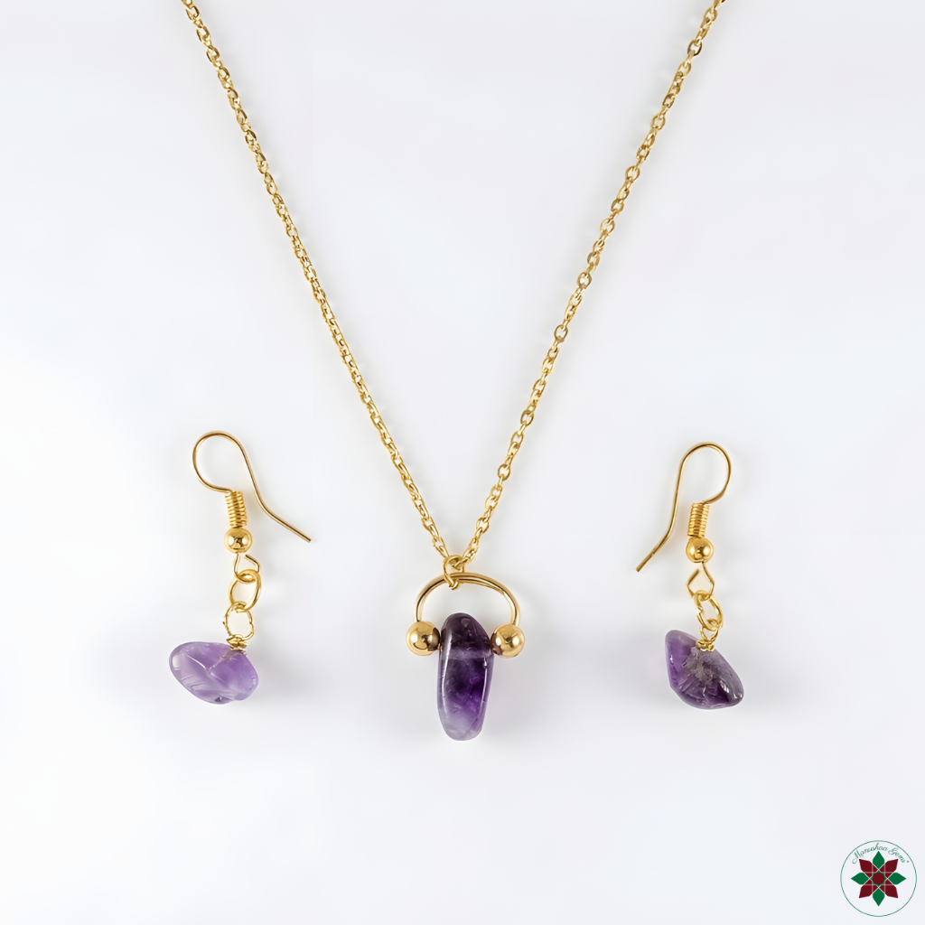Amethyst necklace and drop earrings flat lay on ivory background — complete jewellery set by Manushaa Gems
