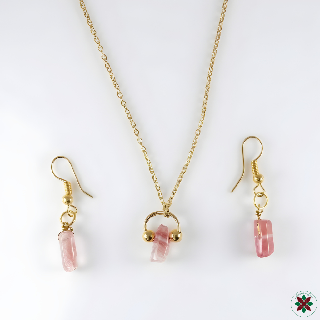 Cherry quartz necklace and drop earrings flat lay on ivory — self-love crystal jewellery set by Manushaa Gems