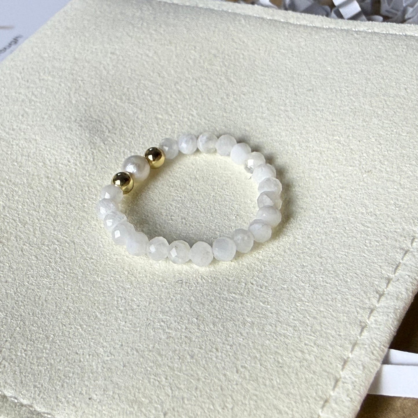 Macro detail of faceted moonstone beads and unique freshwater pearl – handmade stretch ring by Manushaa Gems