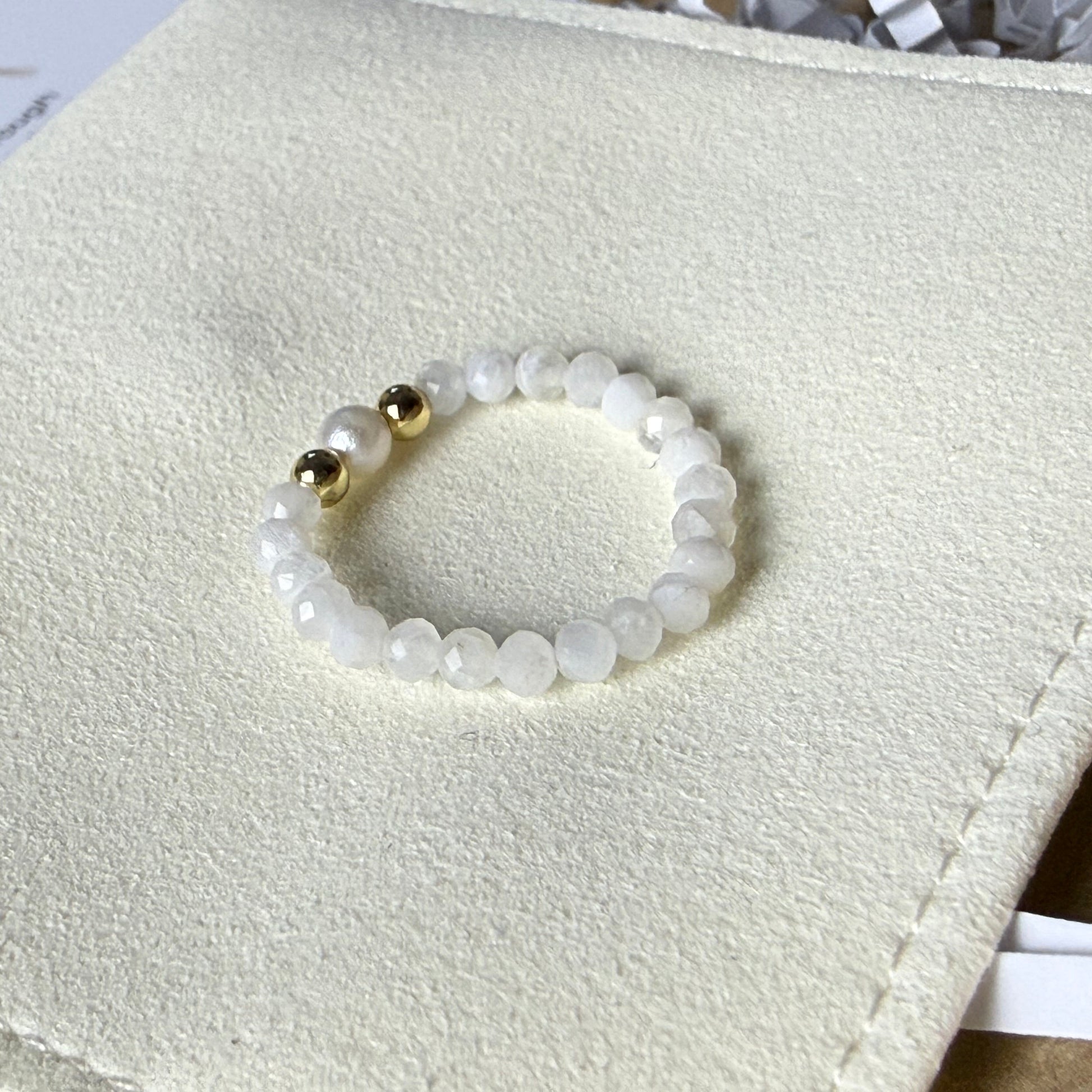 Macro detail of faceted moonstone beads and unique freshwater pearl – handmade stretch ring by Manushaa Gems