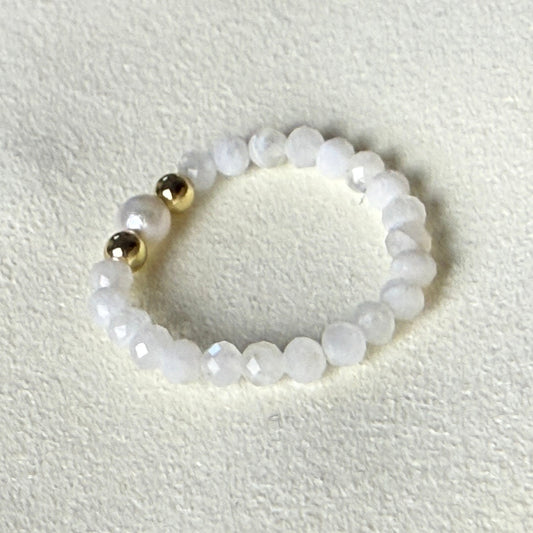 Moonstone and freshwater pearl stretch ring glowing on cream suede – handmade June birthstone ring by Manushaa Gems