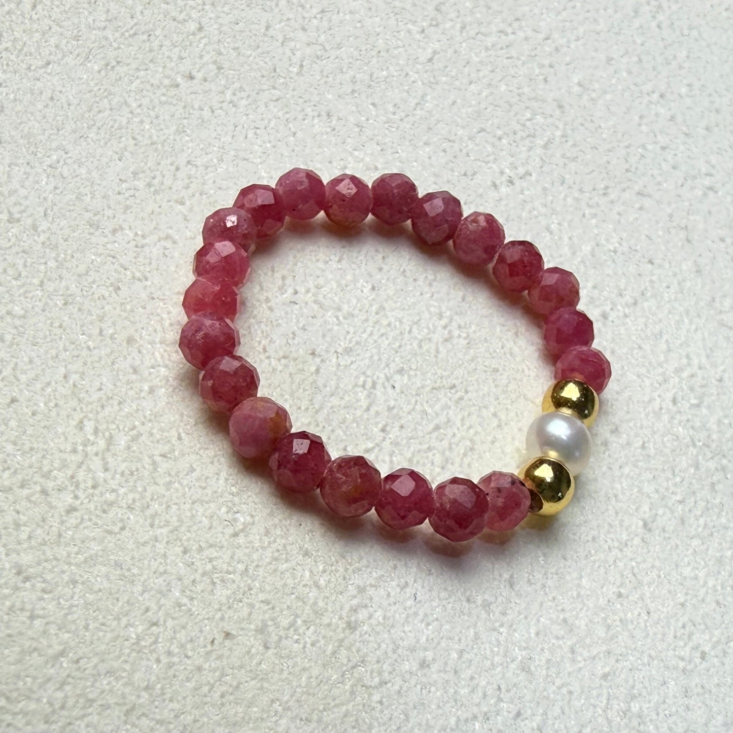 Macro detail of faceted rhodonite beads and unique freshwater pearl – handmade stretch ring by Manushaa Gems