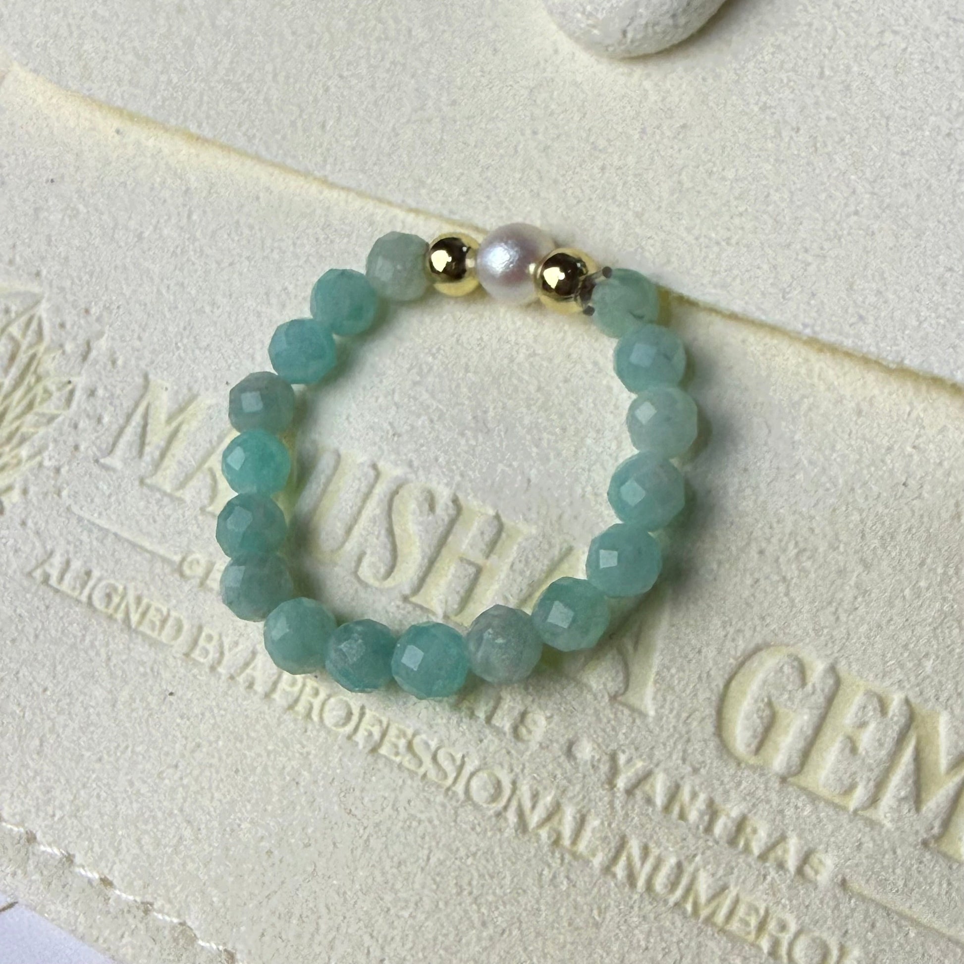 Brazilian amazonite and freshwater pearl stretch ring on cream suede – handmade green crystal ring by Manushaa Gems