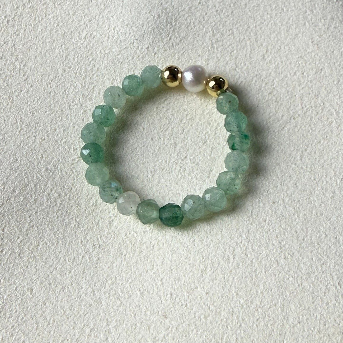 Macro detail of faceted green aventurine beads and unique freshwater pearl – handmade stretch ring by Manushaa Gems