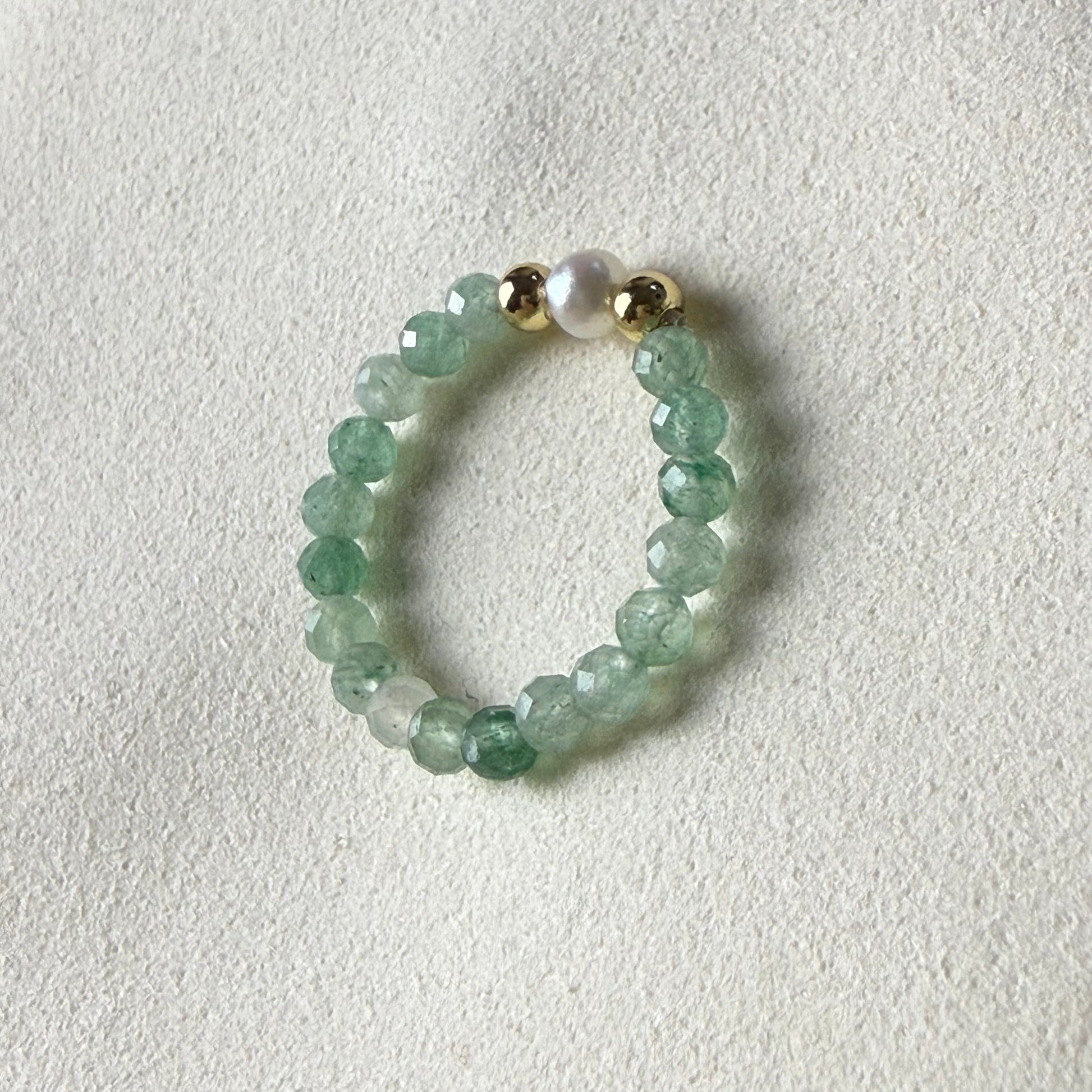 Close-up of spring-green faceted aventurine beads with freshwater pearl and gold accents – Manushaa Gems