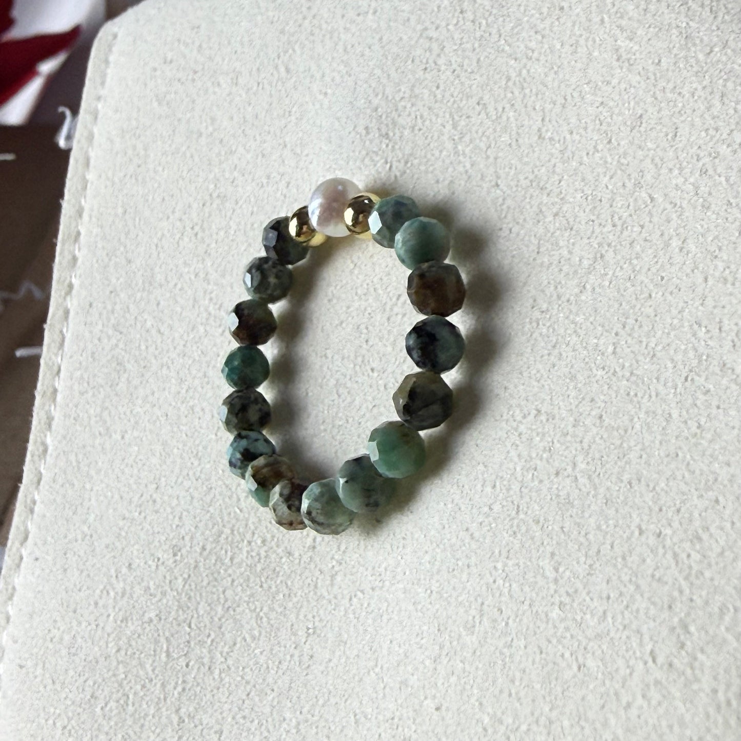 African turquoise and freshwater pearl stretch ring on cream suede – handmade teal crystal ring by Manushaa Gems