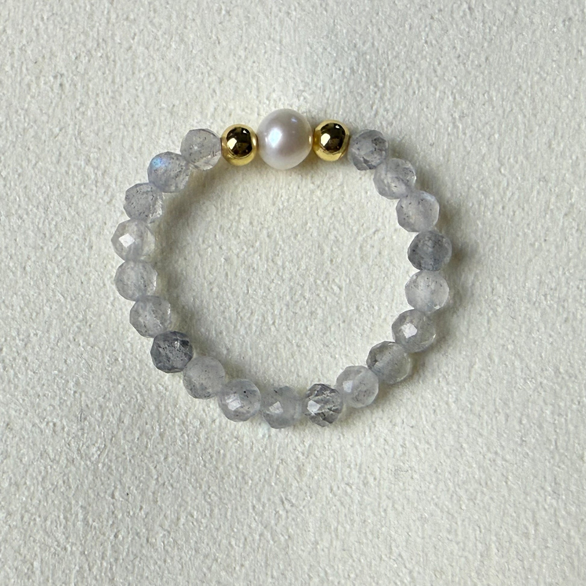 Grey labradorite and freshwater pearl stretch ring on cream suede – handmade crystal ring by Manushaa Gems