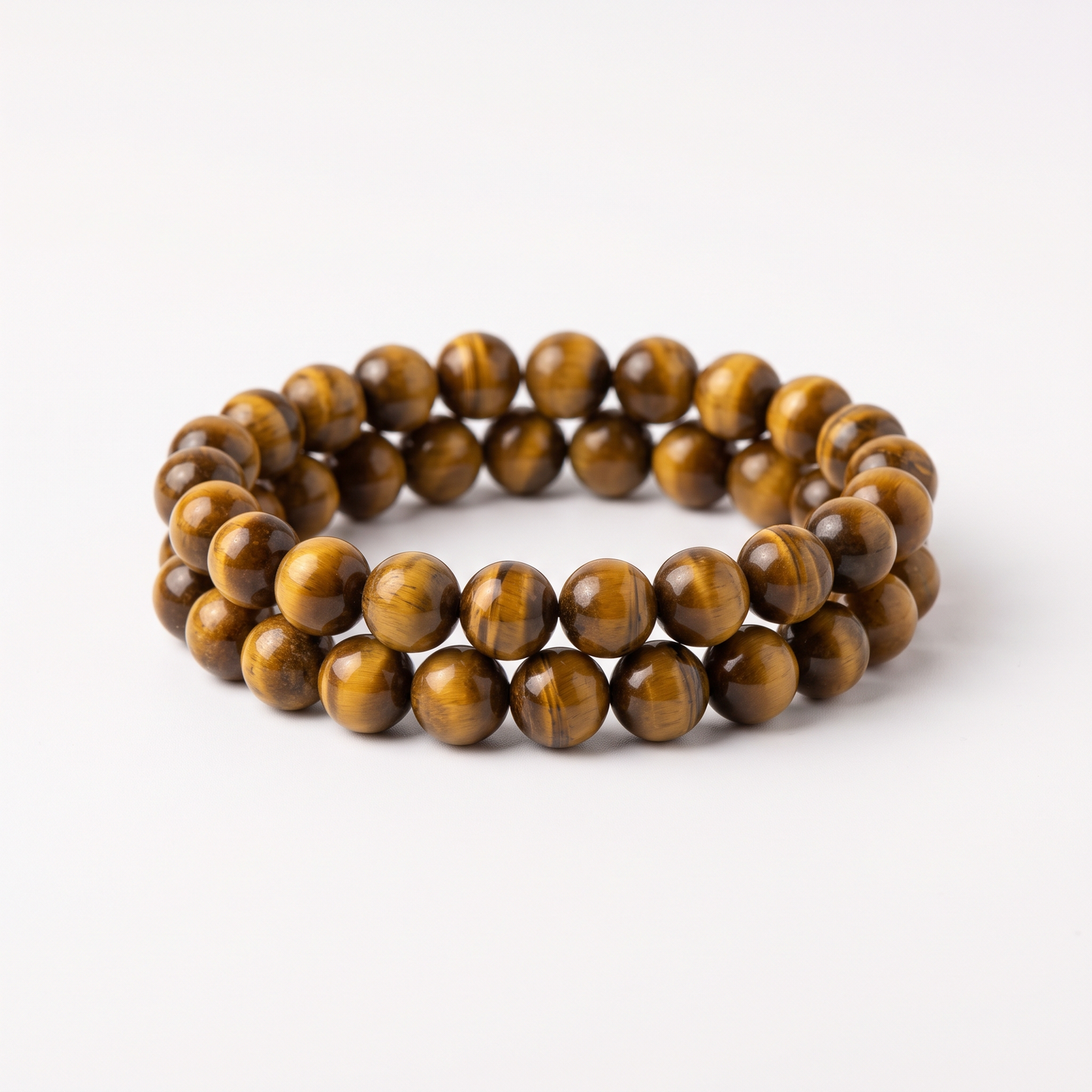 Natural Tiger's Eye 8mm crystal beaded stretch bracelet on white background - Manushaa Gems