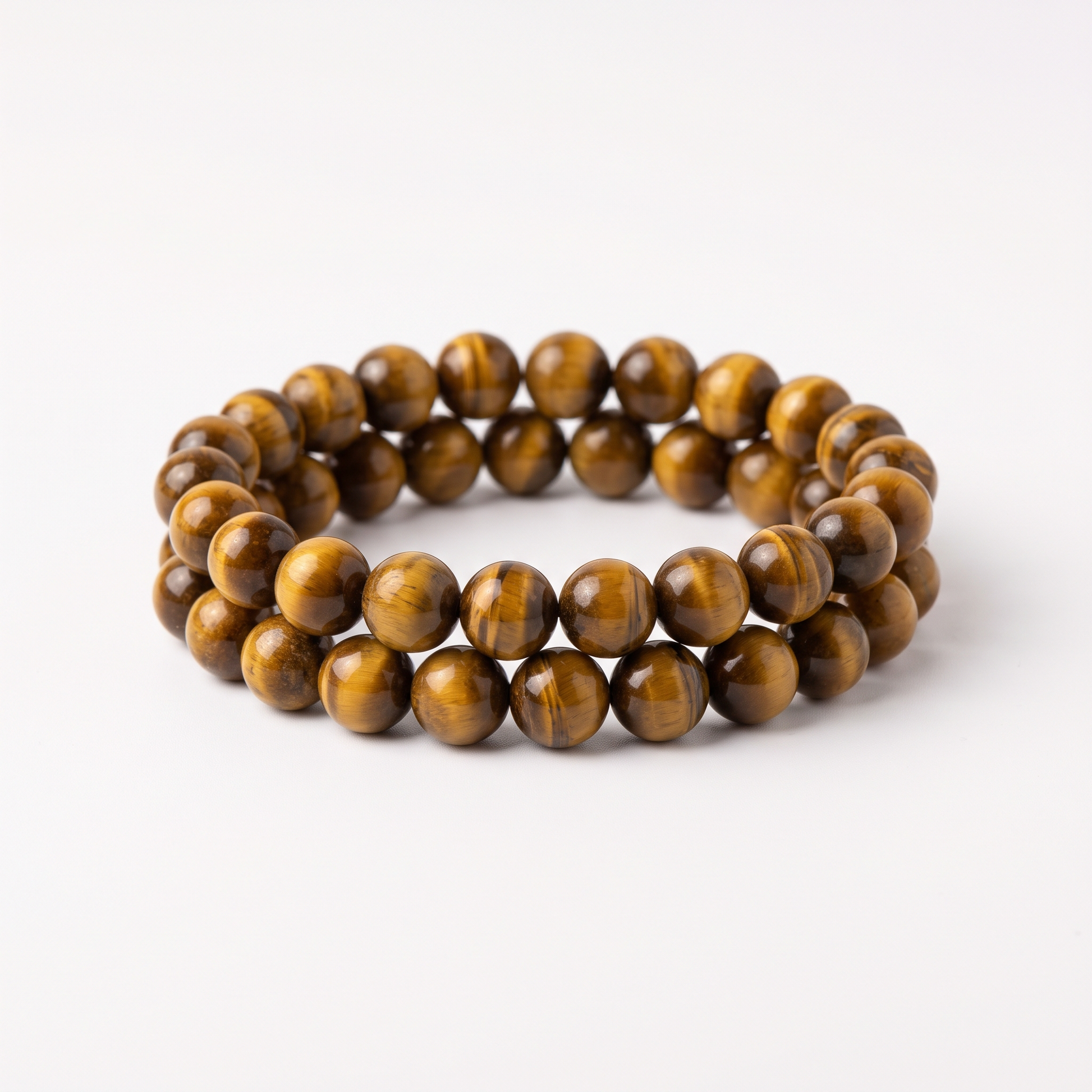 Natural Tiger's Eye 8mm crystal beaded stretch bracelet on white background - Manushaa Gems