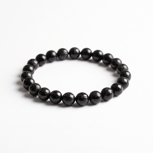Natural Black Tourmaline 8mm crystal beaded stretch bracelet on white background - Manushaa Gems