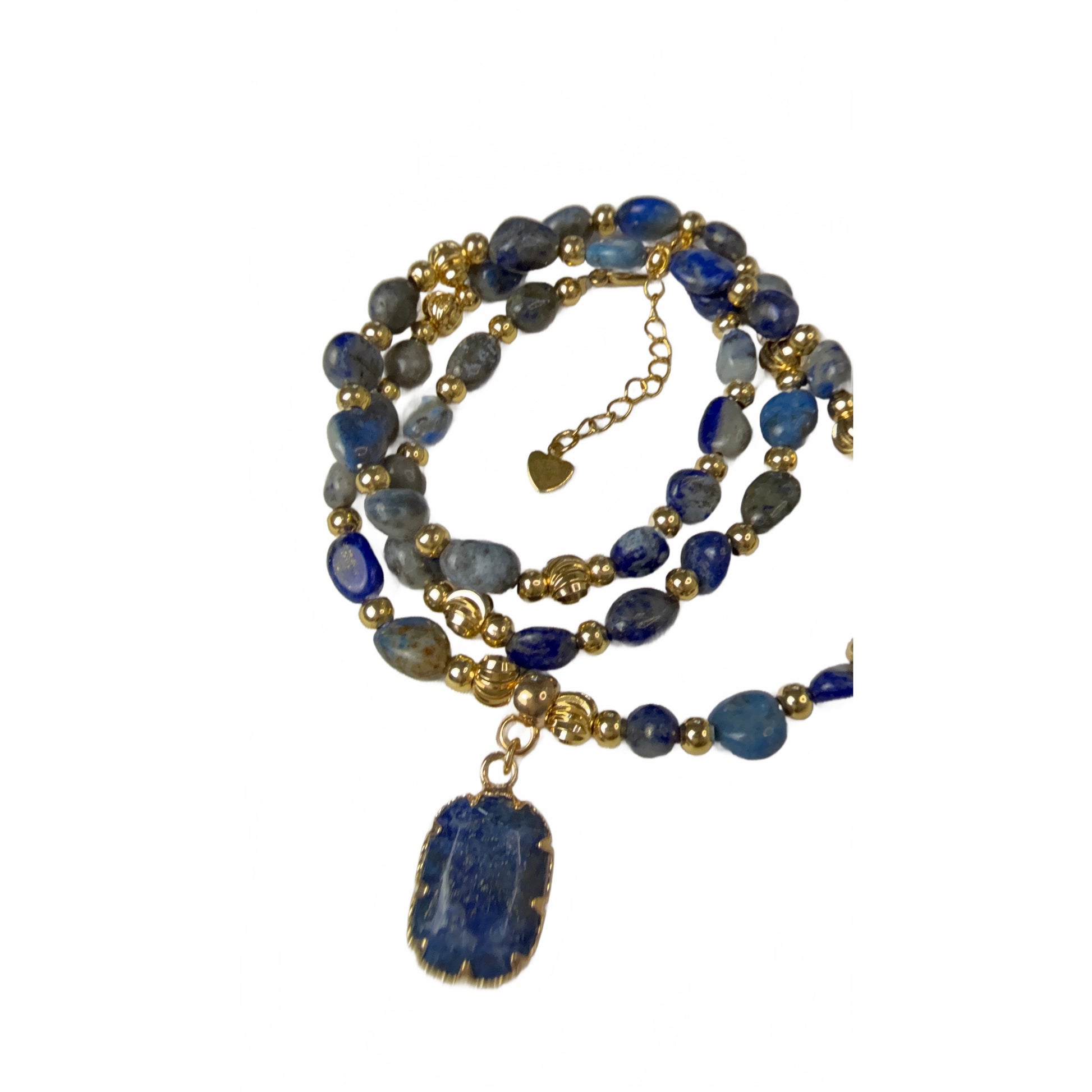 Natural lapis lazuli beaded necklace with gold spacer beads and rectangular lapis pendant, on a white background