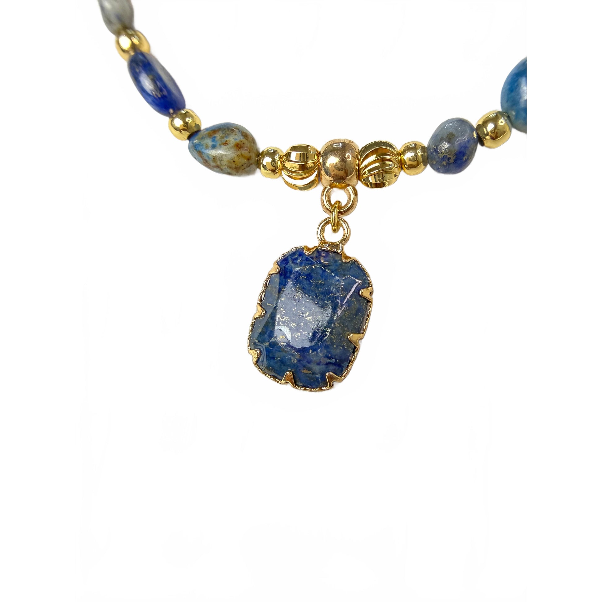 Close-up of the natural lapis lazuli pendant in a gold claw setting, showing blue stone with pale veining