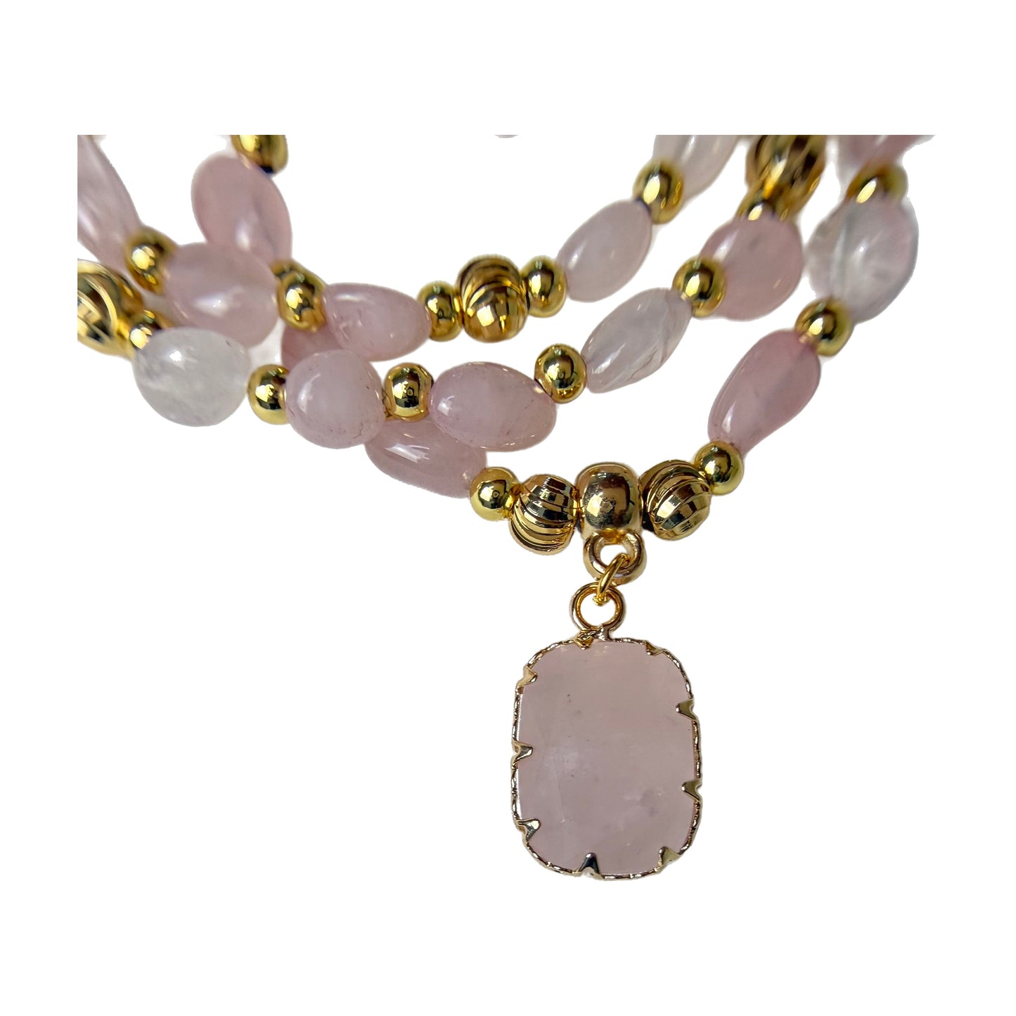 Close-up of the natural rose quartz pendant in a gold claw setting, showing the soft milky pink stone