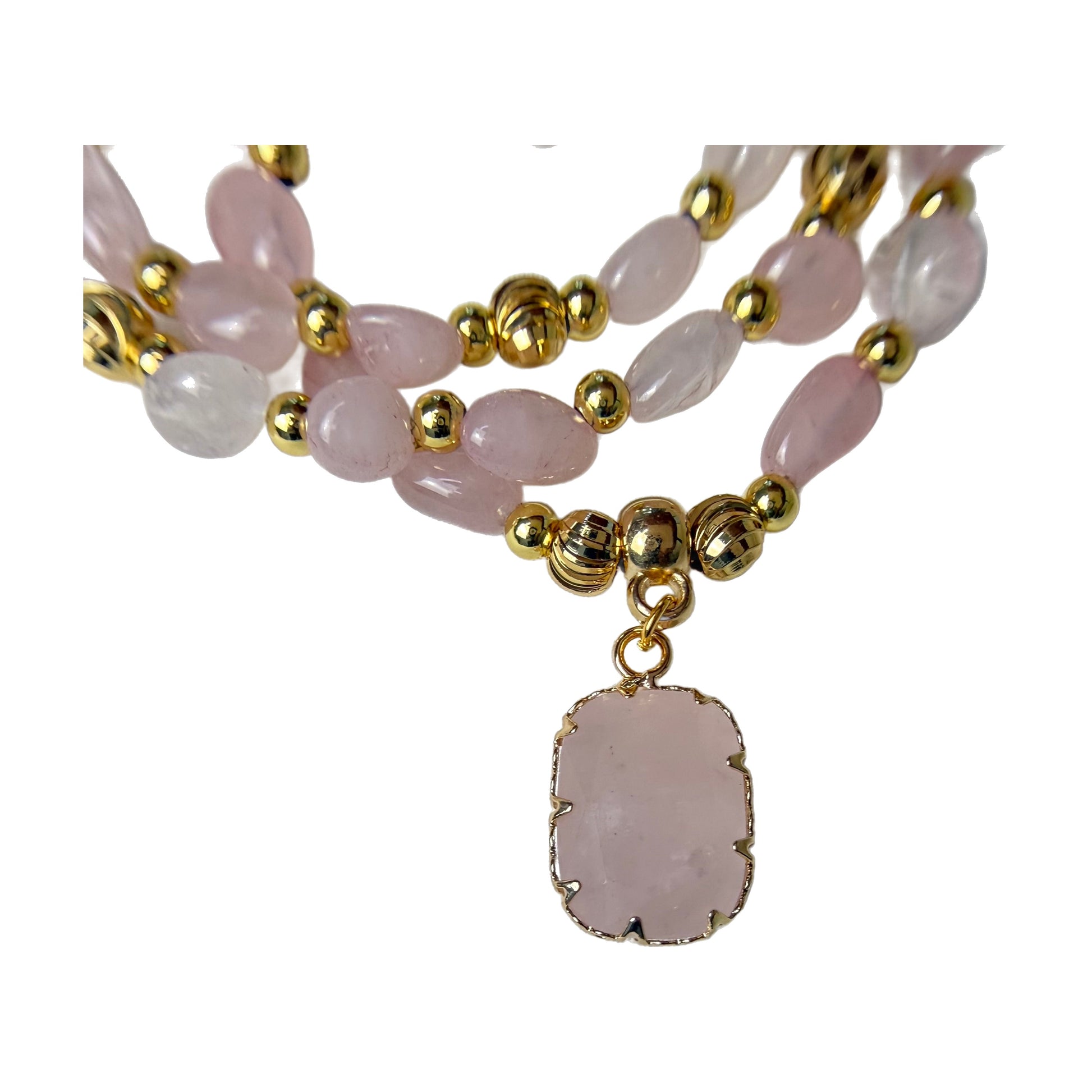 Close-up of the natural rose quartz pendant in a gold claw setting, showing the soft milky pink stone