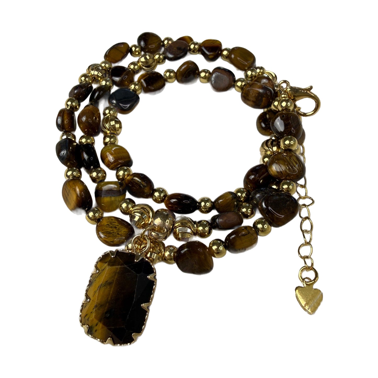 Detail of tumbled natural tiger eye nugget beads in honey gold and deep brown with gold accent beads and heart charm