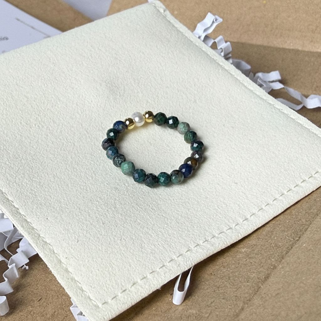 Macro detail of faceted teal azurite beads and unique freshwater pearl – handmade stretch ring by Manushaa Gems