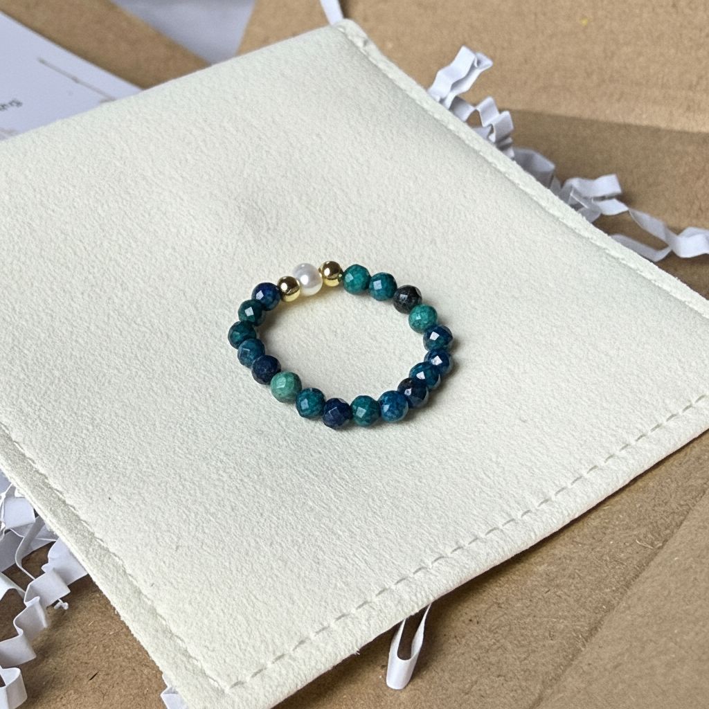 Blue-green azurite and freshwater pearl stretch ring on cream suede – handmade teal crystal ring by Manushaa Gems